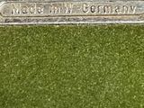 a close up of a silver plate with a name on it