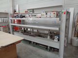 a workbench in a workshop with a lot of tools on it