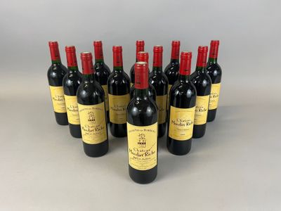 six bottles of red wine lined up in a row