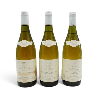 three bottles of white wine sitting next to each other on a white surface