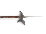 a knife that is on a white surface with a wooden handle
