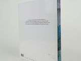 a white book with a blue and red cover on it