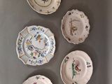 several plates are arranged in a row on a table