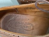 a close up of a pair of shoes with writing on them