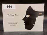 a box with a mask on it on a table