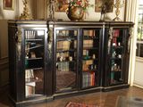an image of a room with a book case and a rug