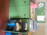 a green cabinet and a blue cabinet in a garage