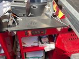 an image of a work station with a lot of work on it
