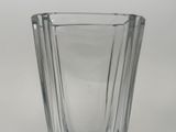 a glass vase that is sitting on a table