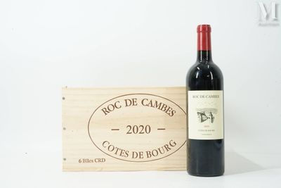 a bottle of wine sitting next to a wooden box