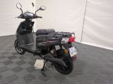 a scooter that is parked in a room