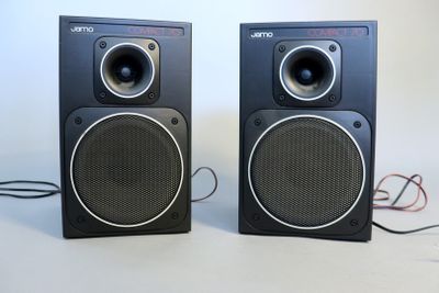 two speakers sitting next to each other on a table