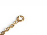 a close up of a chain on a white surface