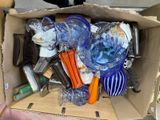 a cardboard box filled with many different types of items