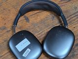 an image of a pair of headphones sitting on top of a wooden floor