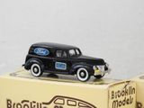 a black toy truck sitting on top of a box