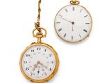 two clocks hanging from a chain on a white background