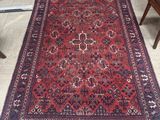 an image of a red rug on the floor in a room