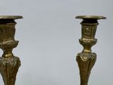 two candles that are sitting on a table