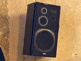 two speakers hanging on the wall next to each other
