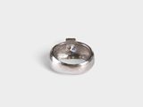 a close up of a ring on a white surface
