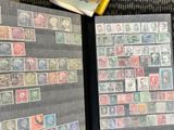 a lot of stamps on the pages of a book