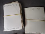 several notes are stacked on top of each other on a table