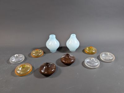 a lot of small vases that are sitting on a table