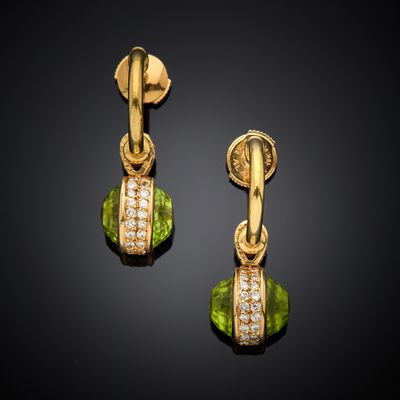 a pair of peridot and diamond earrings