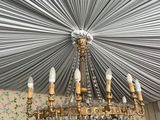 a chandelier hanging from the ceiling in a room