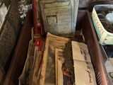 a wooden box with a bunch of old papers in it