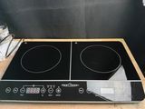 a close up of a stove top with two burners on top of it