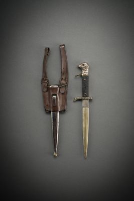 a knife and a knife holder on a table