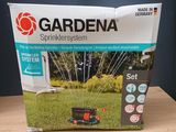 a box of gardena sprinkler system on a table