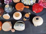 many different types of vases on the table