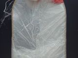 a plastic bag with a duck on it sitting on top of a table