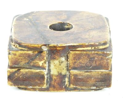 a small box with a hole in the middle of it