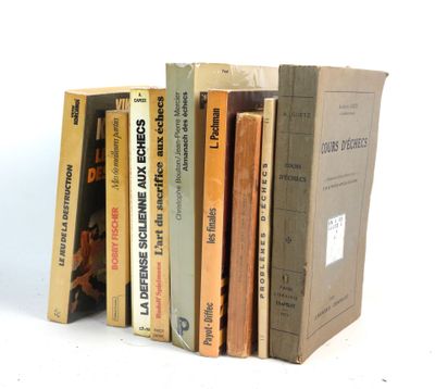 several books are stacked on top of each other on a white surface
