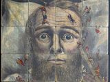 painting of a man with a beard and mustache on a tile wall