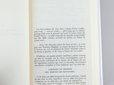 someone is holding a book open to a page with a picture on it
