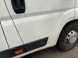 a white van that is parked on the side of the road