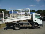 a white truck that is parked in the street