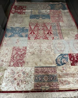 a large patchwork rug on the floor in a room