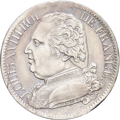 Gros plan sur une pièce d'argent portant le visage d'un homme