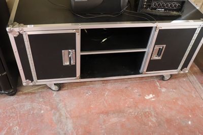 a television sitting on top of a black entertainment center