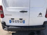 a white van that is parked in a parking lot