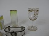 a glass and a wine glass sitting on a table