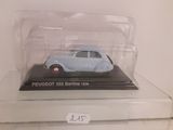 a small toy car in a clear box on a shelf