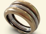 an image of a ring made of silver and gold