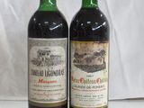 two bottles of wine sitting next to each other on a table